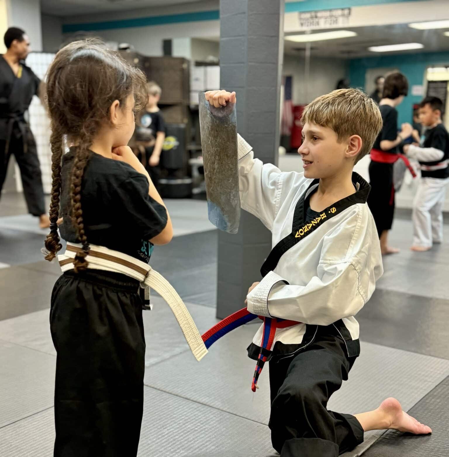 Seven Spears martial arts students practicing drills during class wearing gi uniform.